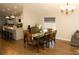 Spacious dining area featuring a dark wood table and seating for eight, adjacent to the kitchen at 149 Southampton Dr, Kissimmee, FL 34744
