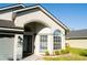 Inviting entrance with decorative door and large windows offering ample natural light at 149 Southampton Dr, Kissimmee, FL 34744