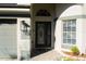 Close up of the front door area, showing the address, front door and sidelight window at 149 Southampton Dr, Kissimmee, FL 34744