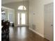 Bright entryway showcasing wood floors and an arched window at 149 Southampton Dr, Kissimmee, FL 34744