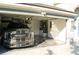Garage featuring epoxy flooring, overhead storage racks and a vehicle at 149 Southampton Dr, Kissimmee, FL 34744