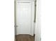 Hallway with wood floors and closet across from the bathroom entrance at 149 Southampton Dr, Kissimmee, FL 34744