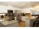 Modern kitchen featuring stainless appliances, granite countertops, white cabinets, and a breakfast bar at 149 Southampton Dr, Kissimmee, FL 34744