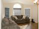 Bright living room with large windows and a comfortable, oversized couch perfect for relaxation at 149 Southampton Dr, Kissimmee, FL 34744