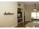 Open living space with fireplace, tv and view of lanai at 149 Southampton Dr, Kissimmee, FL 34744