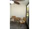 Enclosed patio with small round table and two chairs with views of backyard at 149 Southampton Dr, Kissimmee, FL 34744