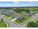 Serene neighborhood featuring well-maintained homes with lush lawns and inviting curb appeal at 15250 Aquarius Way, Mascotte, FL 34753