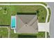 An overhead view of a private home and a refreshing swimming pool at 15250 Aquarius Way, Mascotte, FL 34753