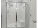 Glass enclosed shower features a rainfall shower head and built-in bench at 15250 Aquarius Way, Mascotte, FL 34753