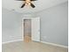 Neutral bedroom with an open door and tiled floors creates a calm and inviting space at 15250 Aquarius Way, Mascotte, FL 34753