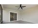 Screened lanai with ceiling fan provides a comfortable outdoor living space at 15250 Aquarius Way, Mascotte, FL 34753