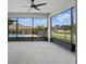 Relaxing screened lanai offering views of the backyard pool and neighborhood at 15250 Aquarius Way, Mascotte, FL 34753
