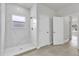 Modern bathroom with a glass-enclosed shower and white marble tile at 15443 Sw 21St Ct, Ocala, FL 34473