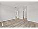 Spacious bedroom with wood-look flooring and ample natural light at 15443 Sw 21St Ct, Ocala, FL 34473