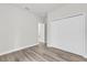 Bedroom with a closet and wood-look floors, offering a clean and versatile space at 15443 Sw 21St Ct, Ocala, FL 34473