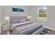 Comfortable bedroom with a large window offering natural light and stylish decor at 15443 Sw 21St Ct, Ocala, FL 34473