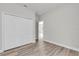 Neutral bedroom with closet and wood-look floors, offering a clean and versatile space at 15443 Sw 21St Ct, Ocala, FL 34473