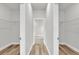 Walk-in closet with built-in shelving and ample storage space at 15443 Sw 21St Ct, Ocala, FL 34473