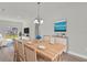 Elegant dining room featuring stylish furnishings and a decorative ocean-themed art piece at 15443 Sw 21St Ct, Ocala, FL 34473