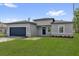 Charming single-Gathering home showcasing a well-manicured lawn and a brick driveway at 15443 Sw 21St Ct, Ocala, FL 34473