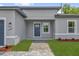 Attractive home exterior with a neatly paved walkway leading to the front door at 15443 Sw 21St Ct, Ocala, FL 34473