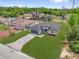 Charming single-story home features a spacious front yard, gray siding, and an attached two-car garage at 15443 Sw 21St Ct, Ocala, FL 34473