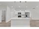 Modern kitchen featuring a large island, stainless steel appliances, and pendant lighting at 15443 Sw 21St Ct, Ocala, FL 34473