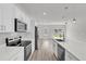 Modern kitchen featuring white cabinetry, stainless steel appliances, and a large island at 15443 Sw 21St Ct, Ocala, FL 34473