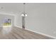 Bright and airy living space with luxury vinyl flooring and an open doorway at 15443 Sw 21St Ct, Ocala, FL 34473