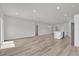 Spacious open-concept living and kitchen area with modern flooring and recessed lighting at 15443 Sw 21St Ct, Ocala, FL 34473
