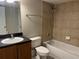 Well-maintained bathroom featuring a shower-tub combo, sleek vanity, and neutral tile at 155 N Pearl Lake Cswy # 104, Altamonte Springs, FL 32714
