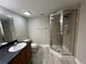 Bathroom with tile shower and vanity with mirror at 155 N Pearl Lake Cswy # 104, Altamonte Springs, FL 32714
