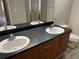 Bathroom featuring dual sinks and a large mirror at 155 N Pearl Lake Cswy # 104, Altamonte Springs, FL 32714