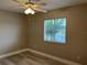 Cozy bedroom with natural light streaming through the window creating a bright and airy atmosphere at 155 N Pearl Lake Cswy # 104, Altamonte Springs, FL 32714