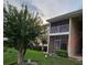 Charming condominium with a screened porch offering outdoor living space in a tranquil setting at 155 N Pearl Lake Cswy # 104, Altamonte Springs, FL 32714
