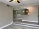 Open-concept living area with modern lighting and seamless transition to the kitchen at 155 N Pearl Lake Cswy # 104, Altamonte Springs, FL 32714