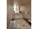 Stairwell to upper level featuring brick pavers and textured walls, and seating at 155 N Pearl Lake Cswy # 104, Altamonte Springs, FL 32714