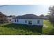 Peaceful backyard with a well-manicured lawn, complemented by the home's practical and clean exterior design at 16367 Sw 17Th Terrace Rd, Ocala, FL 34473