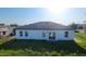 Spacious backyard of a single-Gathering home, featuring a well-kept lawn and a simple, modern exterior at 16367 Sw 17Th Terrace Rd, Ocala, FL 34473
