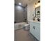 Well-lit bathroom with a white bathtub, gray tile backsplash, and a modern vanity at 16367 Sw 17Th Terrace Rd, Ocala, FL 34473