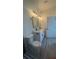 Modern bathroom featuring double sinks with a white cabinet and gray wood-look flooring at 16367 Sw 17Th Terrace Rd, Ocala, FL 34473