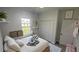 Cozy bedroom showcasing a comfortable bed, bright window, and ample closet space at 16367 Sw 17Th Terrace Rd, Ocala, FL 34473