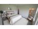 Cozy primary bedroom featuring soft lighting, neutral tones, and a decorative en-suite bathroom at 16367 Sw 17Th Terrace Rd, Ocala, FL 34473