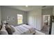 Bedroom featuring large bed, a window, closet and doorway to the living room at 16367 Sw 17Th Terrace Rd, Ocala, FL 34473