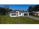 Inviting single-Gathering home with a well-maintained lawn and a stylish exterior, showcasing a warm and welcoming curb appeal at 16367 Sw 17Th Terrace Rd, Ocala, FL 34473