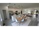 Open-concept kitchen with a central island, seamlessly flowing into the dining and living areas, ideal for entertaining at 16367 Sw 17Th Terrace Rd, Ocala, FL 34473