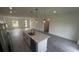 Modern kitchen with a large island, quartz countertops, and stainless steel appliances flows to living space at 16367 Sw 17Th Terrace Rd, Ocala, FL 34473