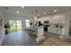 Modern kitchen featuring an island with pendant lighting, stainless steel appliances, and ample cabinet space at 16367 Sw 17Th Terrace Rd, Ocala, FL 34473