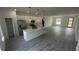 Contemporary kitchen featuring a large island, stainless steel appliances, and open access to the living area at 16367 Sw 17Th Terrace Rd, Ocala, FL 34473