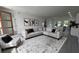 Spacious living area showcasing a comfortable sofa, modern artwork, and stylish decor for relaxation at 16367 Sw 17Th Terrace Rd, Ocala, FL 34473
